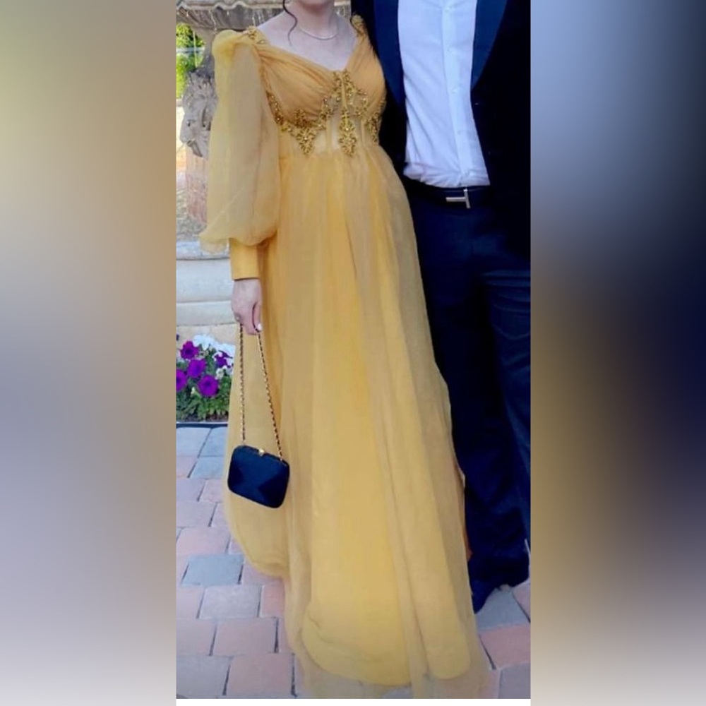Yellow long sleeve dress. Worn once. The waist is tight at the bust.